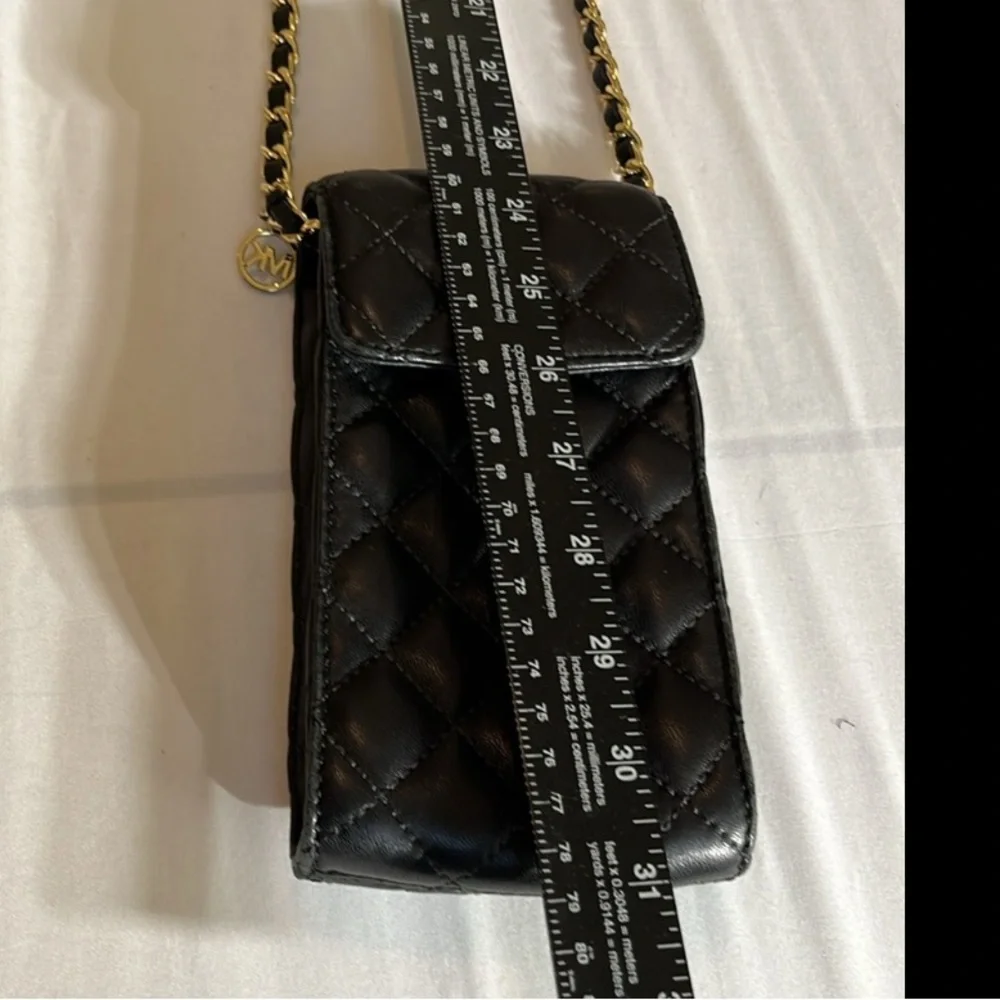 Micheal Kors Sloane black quilted leather crossbody gold hardware snap closure